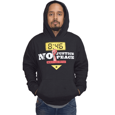 A man wearing a black hoodie with the words " no justice no peace ".